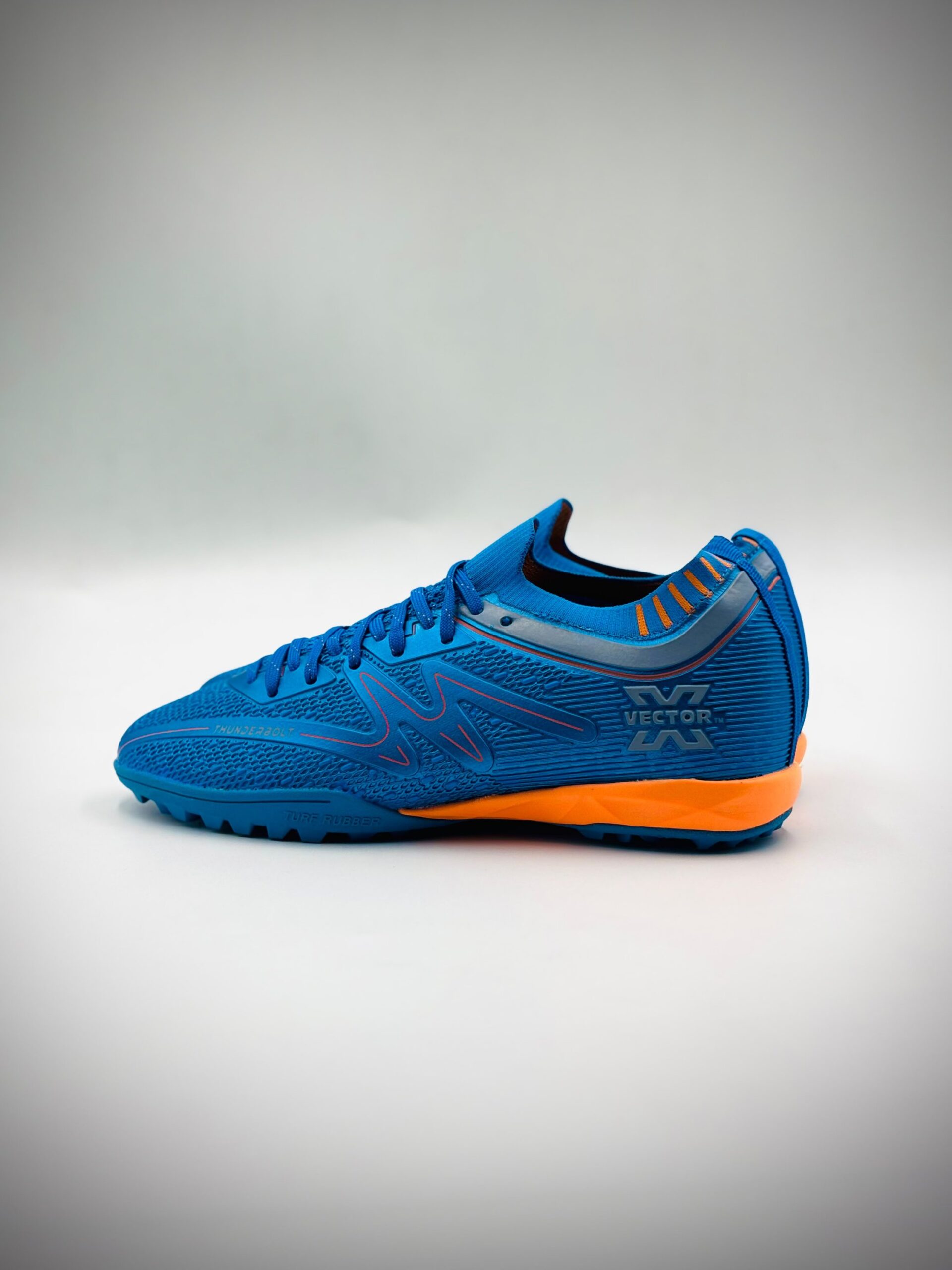 VECTOR X THUNDERBOLT BLUE ORANGE TURF BOOT